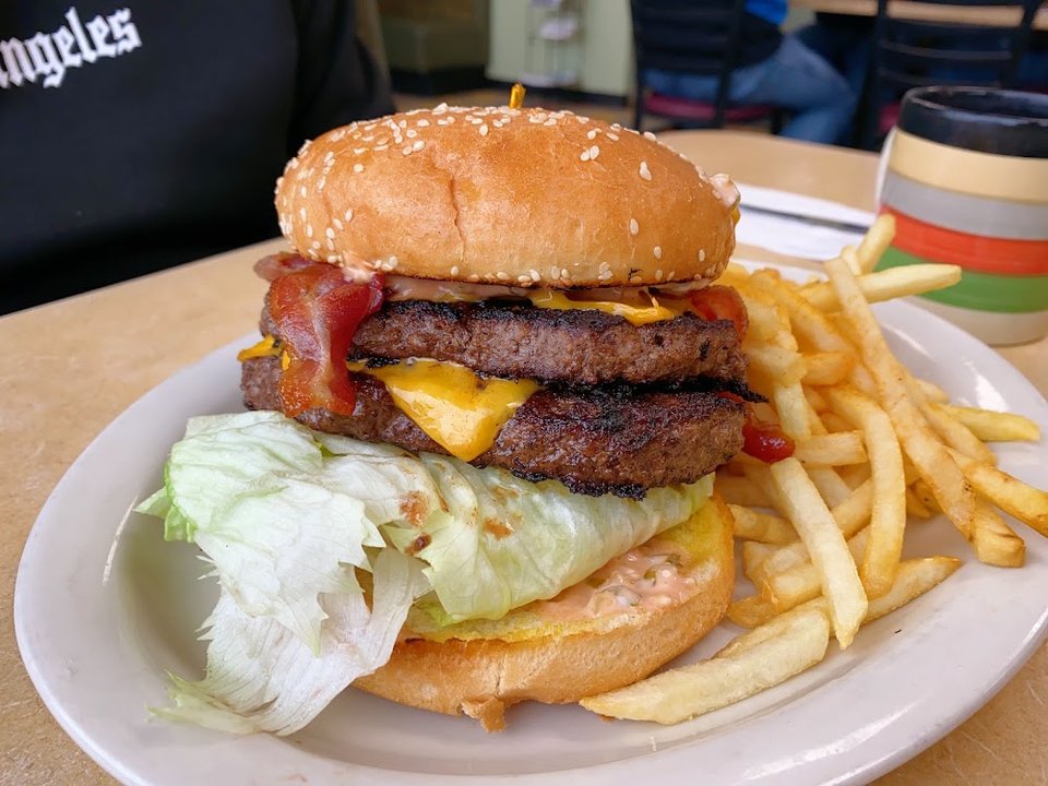 Menu page with burgers and sandwiches.